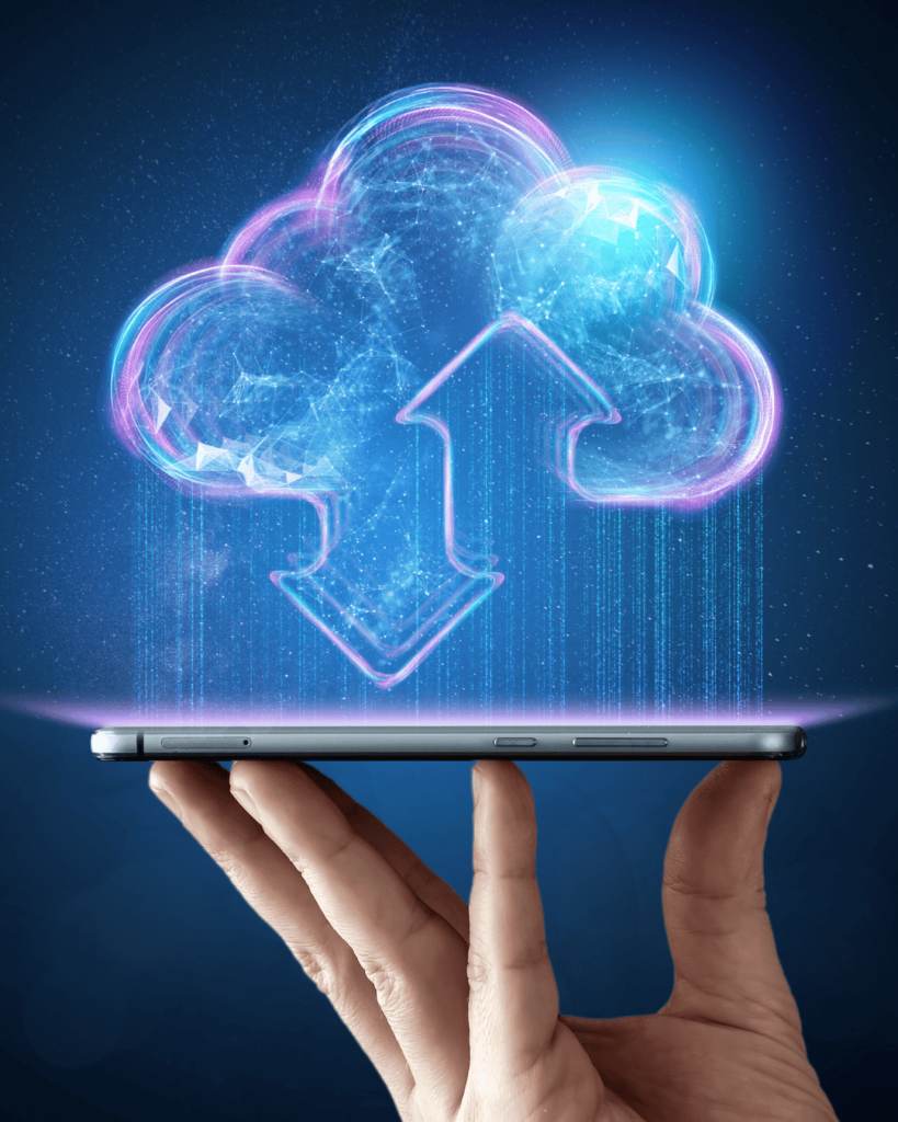 a hand holding up a tablet, with a digital 3d cloud hovering above the tablet screen